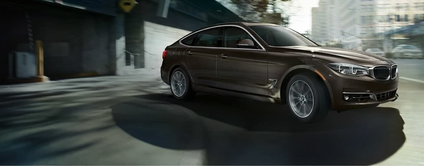 car%20dealer%20near%20Chapel%20Hill%20-%202019%20BMW%203%20Series%20Gran%20Turismo%20-%20Brown.jpg A brown 2019 BMW 3 Series Gran Turismo leaving a parking garage.