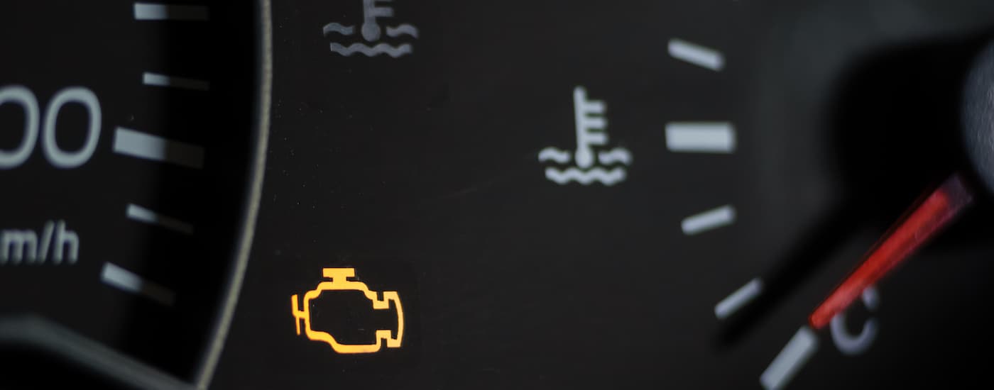 A close up of a vehicle's check engine light.