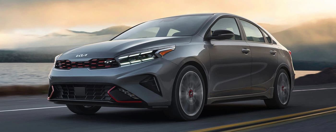 car dealer near Chapel Hill - 2023 Kia Forte GT - Lake.jpg A gray 2023 Kia Forte Gt driving to a car dealer near Chapel Hill.