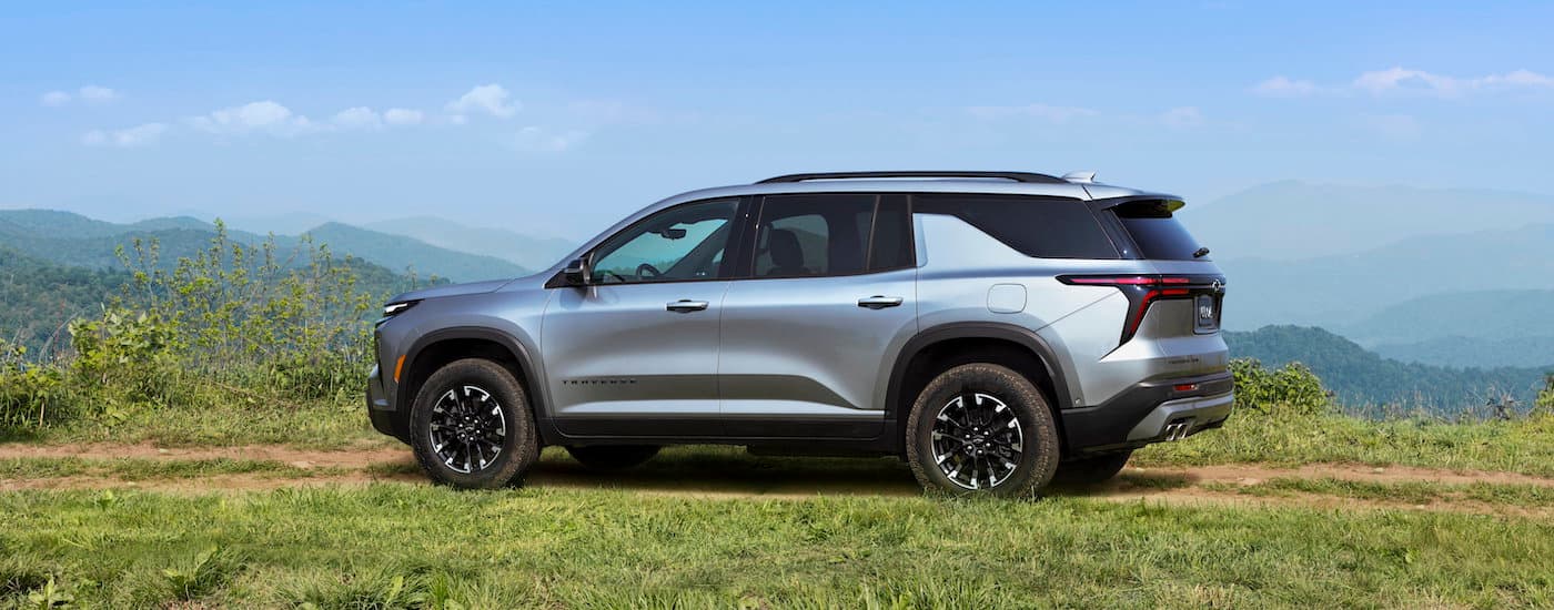 A silver 2025 Chevy Traverse Z71 from the side.