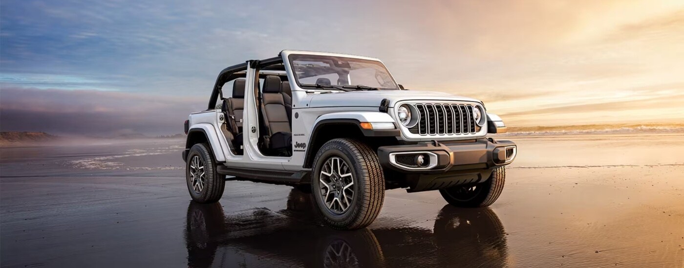 A white 2025 Jeep Wrangler from the front.