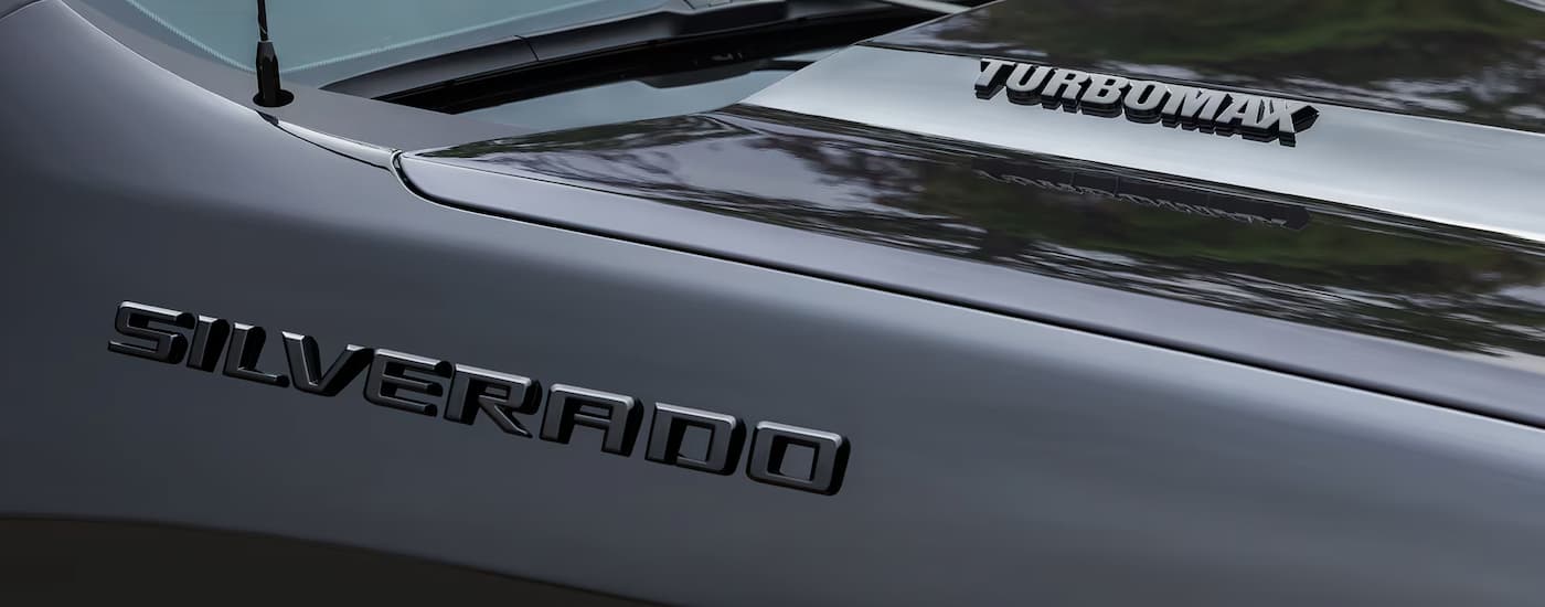 Car%20Dealership%20Near%20Wilmington%202025%20Chevy%20Silverado%201500%20Turbomax%20Blackout%20-%20Hood.jpg Hood of a black 2025 Chevy Silverado 1500 Turbomax