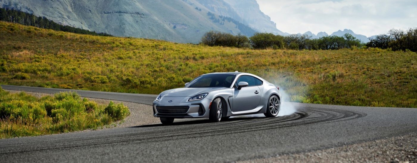 2022 Subaru BRZ - Corner.jpg A silver 2022 Subaru BRZ is shown drifting around a corner.