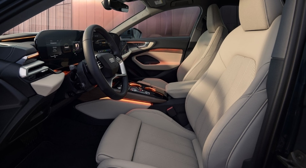 The tan and black leather interior is shown in a 2025 Audi A5.