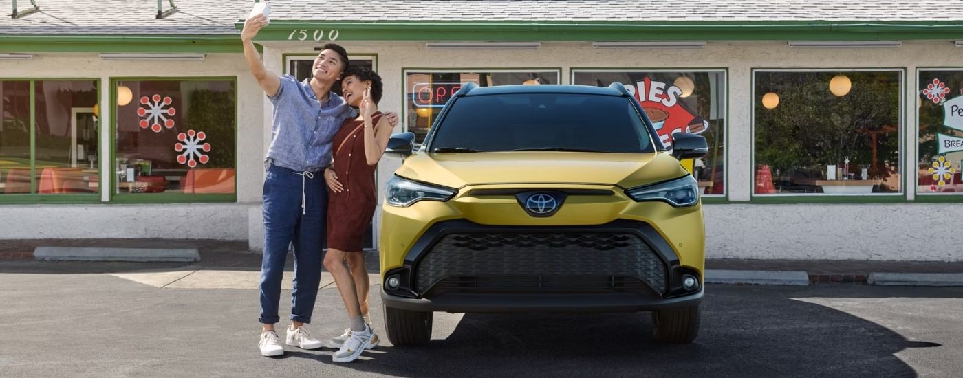 2024%20Toyota%20Corolla%20Cross%20-%20Yellow%20Front.jpg Yellow 2025 Toyota Corolla Cross parked in front of a store.