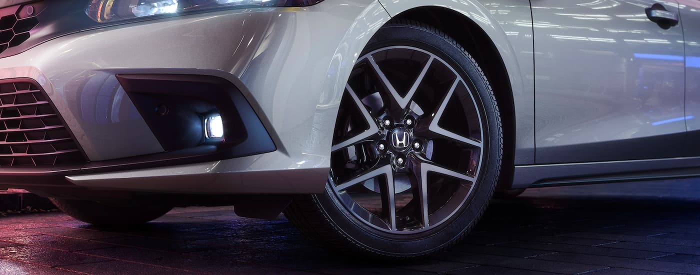 2023 Honda Civic Sport Touring - Rim.jpg A close up shows the wheel on a silver 2023 Honda Civic Sport Touring.