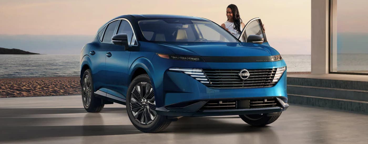 Blue 2025 Nissan Murano Platinum parked at a car dealership near Atlanta