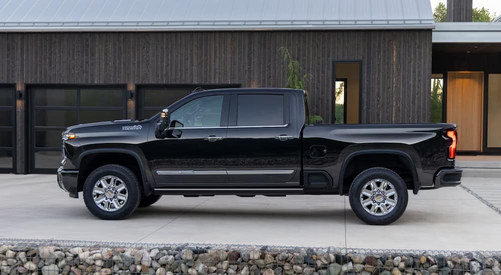 Side of a black 2025 Chevy Silverado 2500 HD parked in a driveway